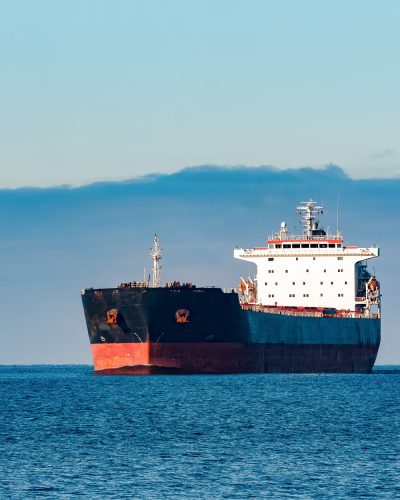 black-cargo-ship-moving-still-baltic-sea-water-riga-europe (1)