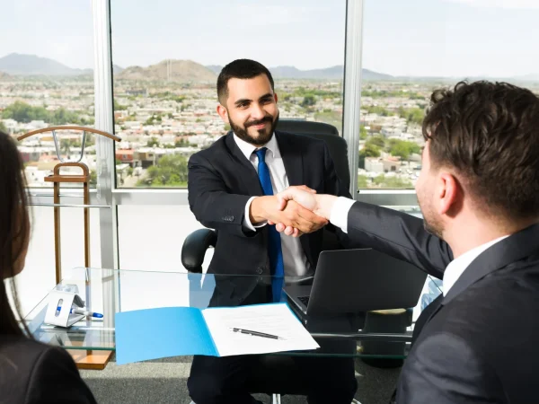 businessman-shaking-hands-with-company-executive-after-making-lucrative-business-deal-smiling-sales-representative-making-successful-sale